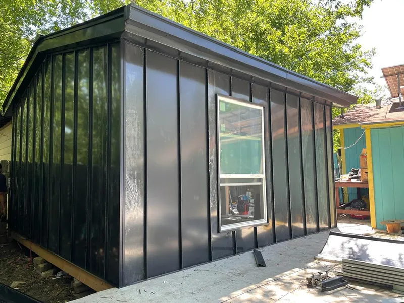 Black standing seam metal wall panels for Metal Roof Installation in Rainsville