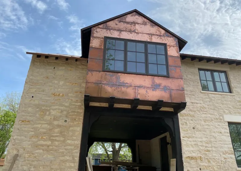Copper metal panel facade on a stone building for Metal Roof Coating in Rainsville